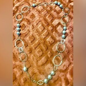 Elegant Silver Necklace with Light Blue Accents and Oval Shapes